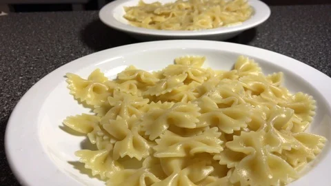 Farfalle with tomato paste on a white plate 動画素材 106575142