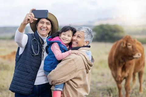 Farm, agriculture and selfie of parents and girl in countryside for holiday Stock Photos