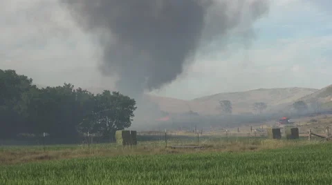 Farm building destroyed by wildfire fireman watch fast 4K 004 Stock Footage 51685237