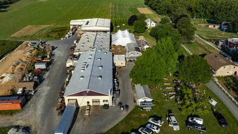 Farm Complex With Storage Facilities and Equipment Surrounded by Fields on .. Stock Photos