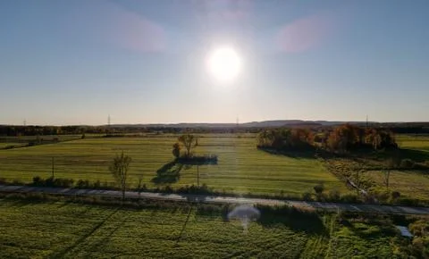 Farm fields with a lens flare Stock Photos