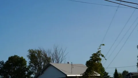 Farm Fields &amp; Wind Power Generators in the distance during a sunny afternoon Stock Footage 80390683