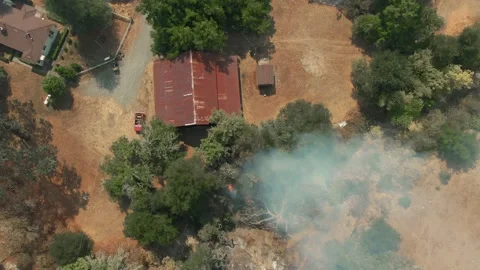 Farm on fire. LNU Lightning Complex Fire, Napa, California, USA. August 2020. Stock Footage 138077476