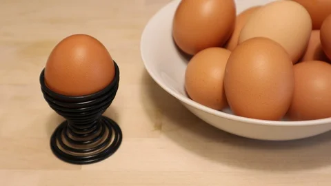 Farm Fresh Brown Egg Placed into Egg Cup Holder Vidéo 128648232