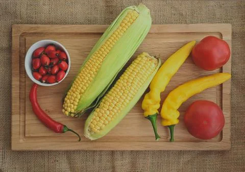 Farm Fresh Vegetable Assortment with Corn, Peppers and Tomatoes Fotos de archivo