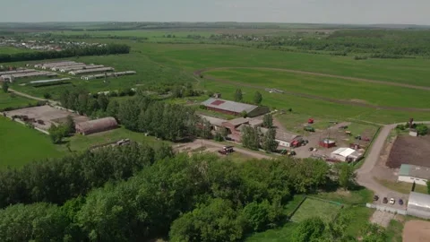 A farm with green meadows and fields. A farm with a race track Stock Footage 269955480