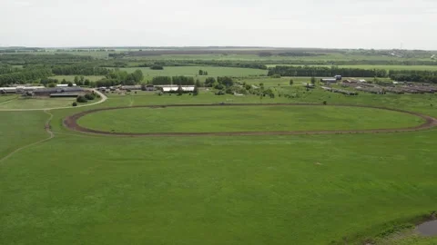 A farm with green meadows and fields Stock Footage 274503271