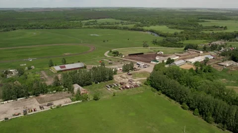 A farm with green meadows and fields Stock Footage 274503323
