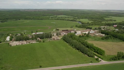 A farm with green meadows and fields Stock Footage 274503326