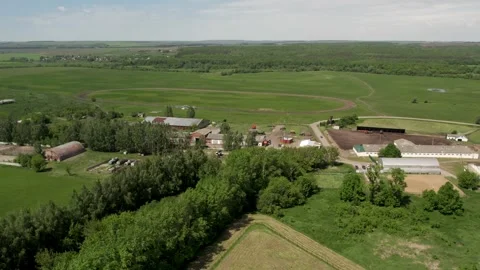 A farm with green meadows and fields Stock Footage 274503336