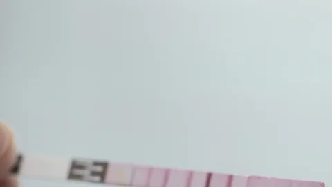 Farm laboratory process. pH paper milk test. 動画素材 90759496