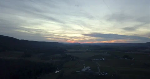 Farm on large plot of land at sunset - aerial view Vídeos de archivo 132556641