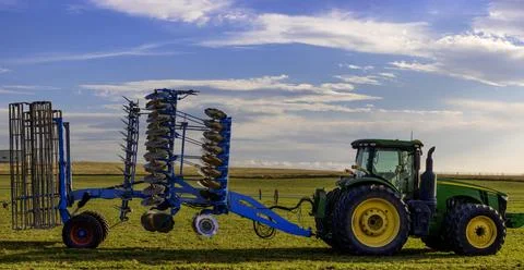 Farm tracker with attached implement in Oregon, USA Stock Photos