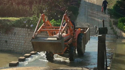 Farm Tractor Crossing Combination Bridge and Dam, with Sound 库存影片 74626138