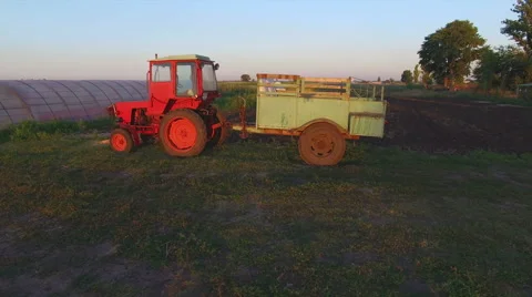 Farm tractor in a field Stock Footage 53209361