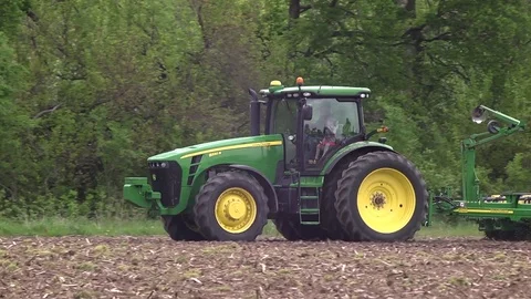 Farm tractor seeding with man and child Video stock 75095778