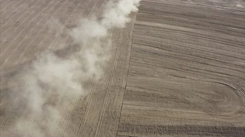 Farm Tractor Tills An Empty Field, Buttonwillow, California Drone Aerial View Video stock 145924068