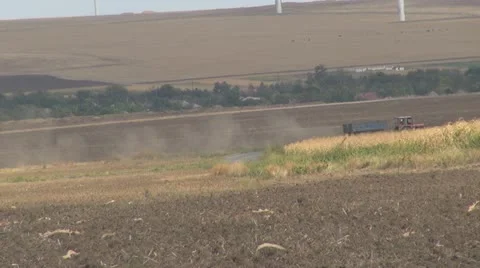 Farm tractor working the ground Stock Footage 10841757