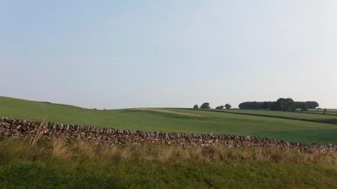 Farm wall and fields Stock Photos