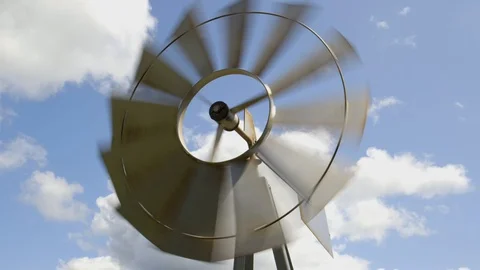 A Farm Windmill Spins in the Sky - Low Shutter Speed 库存影片 128159288