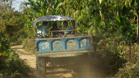 Farm Workers Riding Tractor Trailer on Rural Road. Stock Footage 327608293