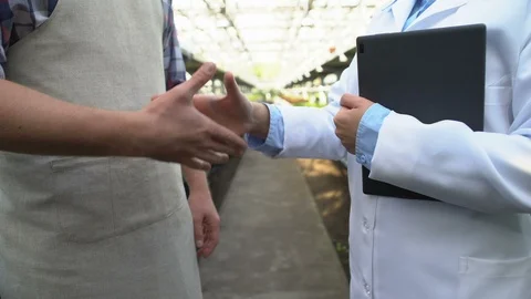 Farmer and quality control expert handshake, agriculture business certification Stock-Footage 118960333