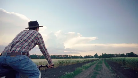 Farmer on bicycle Stock Footage 109050655