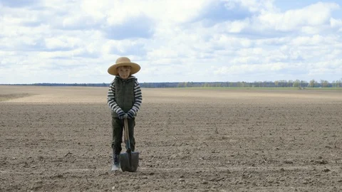 Farmer boy in the field Stock Footage 128912322