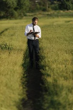 Farmer checking harvest with tablet Stock Photos