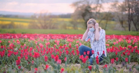 Farmer Checking Tulips In Farm During Coronavirus Crisis Video stock 129514687
