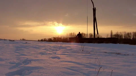 Farmer checking on water well in winter Stock Footage 49099779