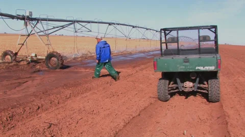 Farmer checks spray nozzle Stock Footage 27571389