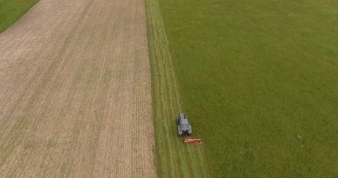 Farmer cutting grass with tractor Stock Footage 95523192