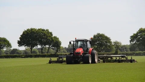 Farmer cutting high quality grass in preperation for lawn turf yorkshire uk Stock Footage 76209319
