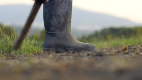 A farmer dig soil with a hoe close up 動画素材 131757497