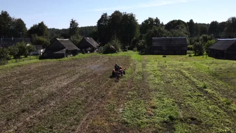 Farmer digs potatoes with a small tractor Stock Footage 165822234