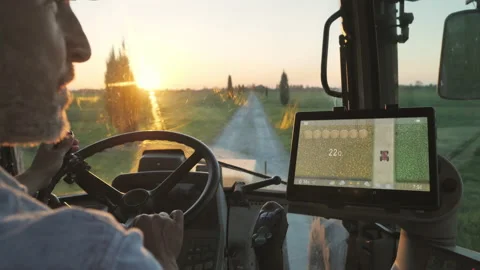 Farmer drives tractor uses smart display touch screen app agriculture technology Stock Footage 152255835