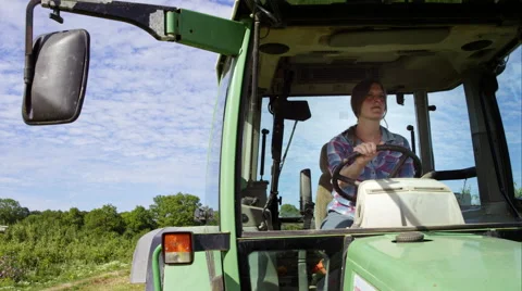 Farmer driving her tractor. Stock Footage 63017174