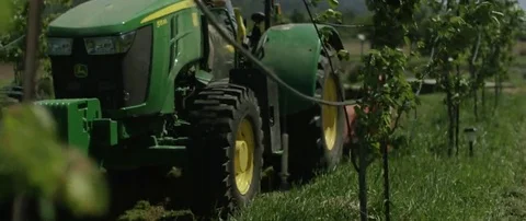 Farmer driving the tractor backwards in the field Stock Footage 69201729