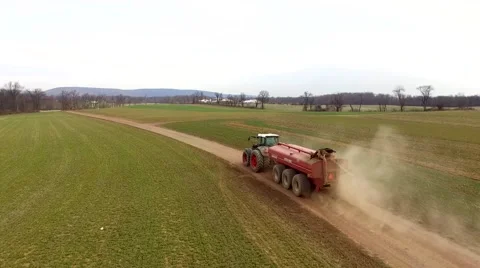 Farmer Driving Tractor Down Dusty Dirt Field Lane Aerial Stock Footage 61175671