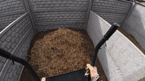 Farmer dumping chicken manure on compost - POV organic farm Video stock 320514846