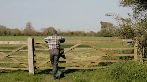 Farmer at gate LS Stock Footage 23002490