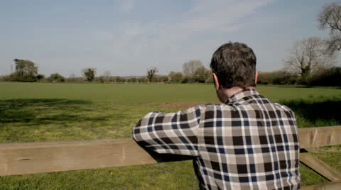 Farmer at gate MS Stock Footage 23001419