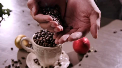 Farmer Hands hold Roasted Coffee Beans. Coffee grains Falls Down from palm. 스톡 동영상 120556764