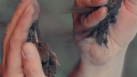 Farmer hands pour soil into hands, priming, soil, agriculture farm, nutrient Stock Footage 270521600