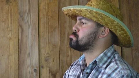 The farmer in the hat with the face looking to the side Stock Photos