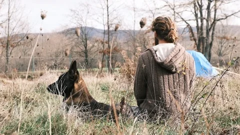 Farmer with his wolf in nature spring Stock Footage 146194950