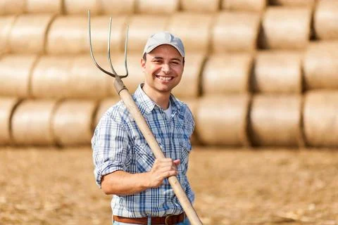 Farmer holding a pitchfork Stock Photos
