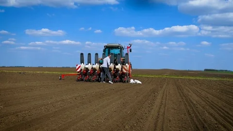 Farmer loading seeder with soybean seed. Stock Footage 86490935