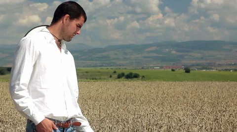 Farmer Looking at a Wheat Field Work Satisfaction Concept Stock Footage 42046337